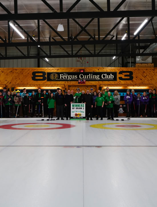 2024 Curl For A Cause attendees gathered on Fergus Curling Club  ice surface.