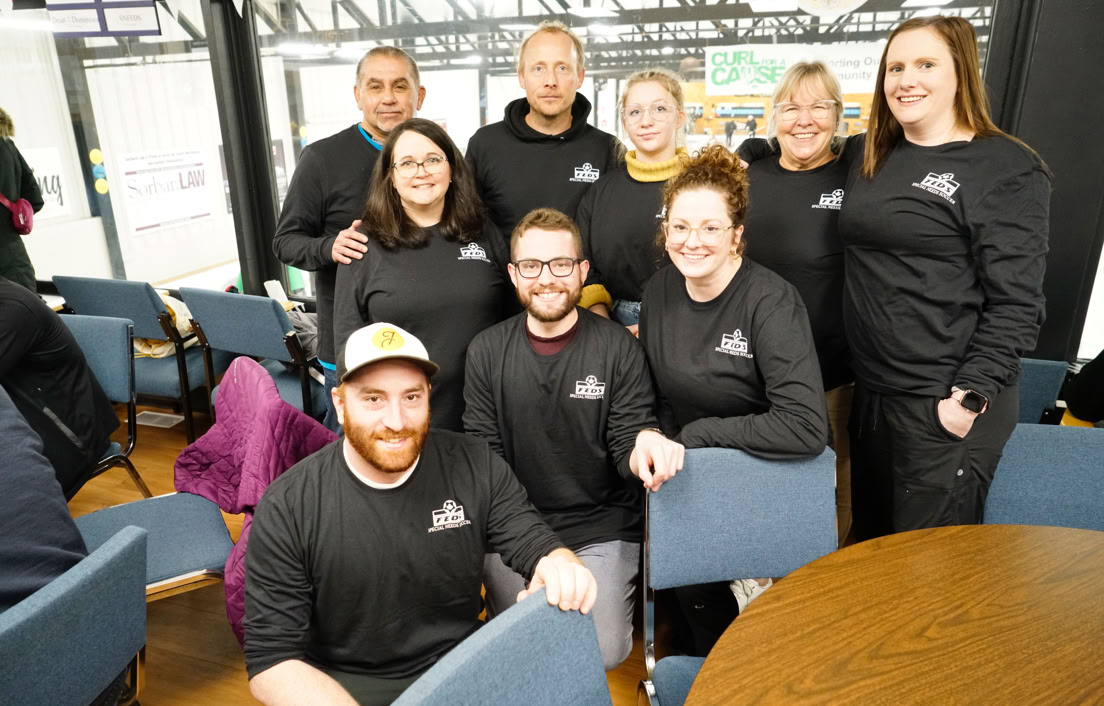 2023 Curl For A Cause attendees gathered in the Fergus Curling Rink lounge.