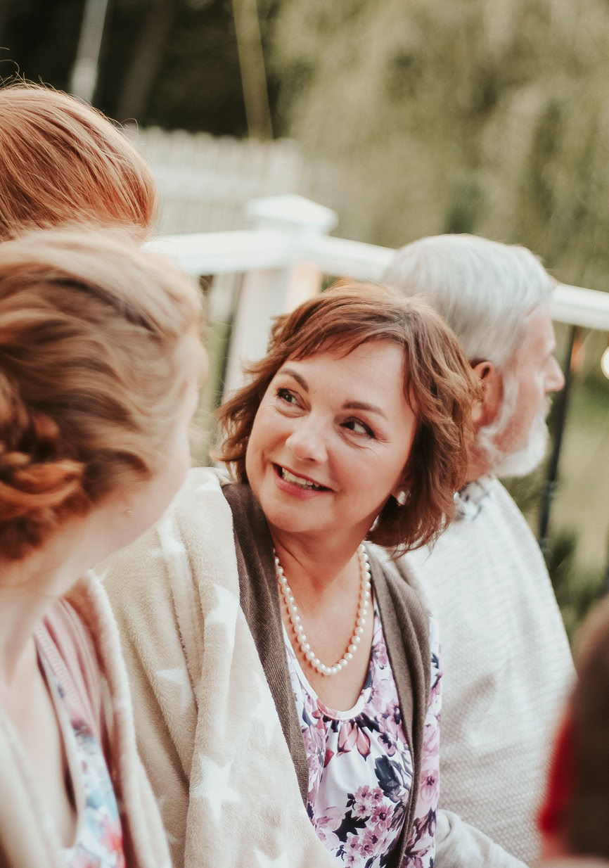 Group of people sitting outside chatting