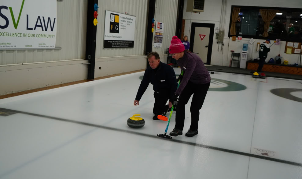Releasing the curling rock at 2024 Curl for a Cause event.