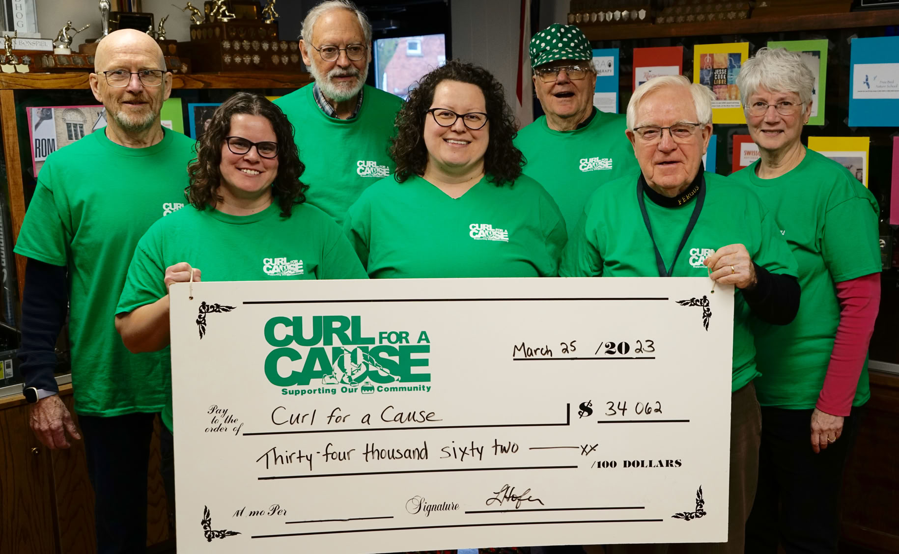 Curl For A Cause Founding Members presenting proceeds from 2023 fundraising event. 